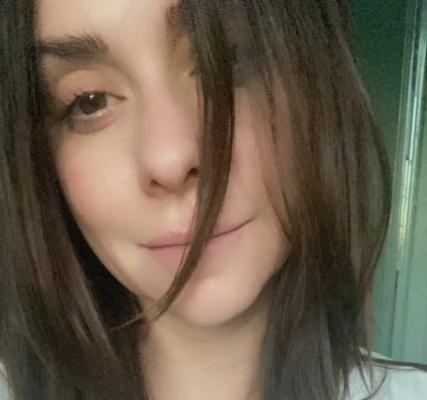 Jennifer Love Hewitt smiling at the camera in a selfie-style portrait