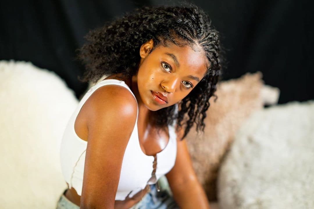 Azriel Clary poses for a portrait in a white tank top