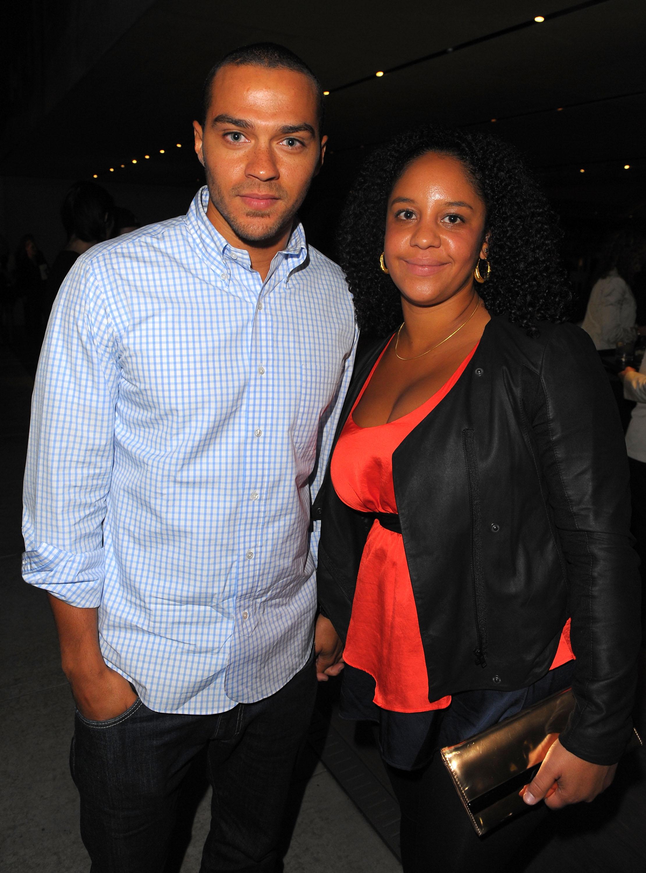 Jesse Williams and a woman posing together at an event
