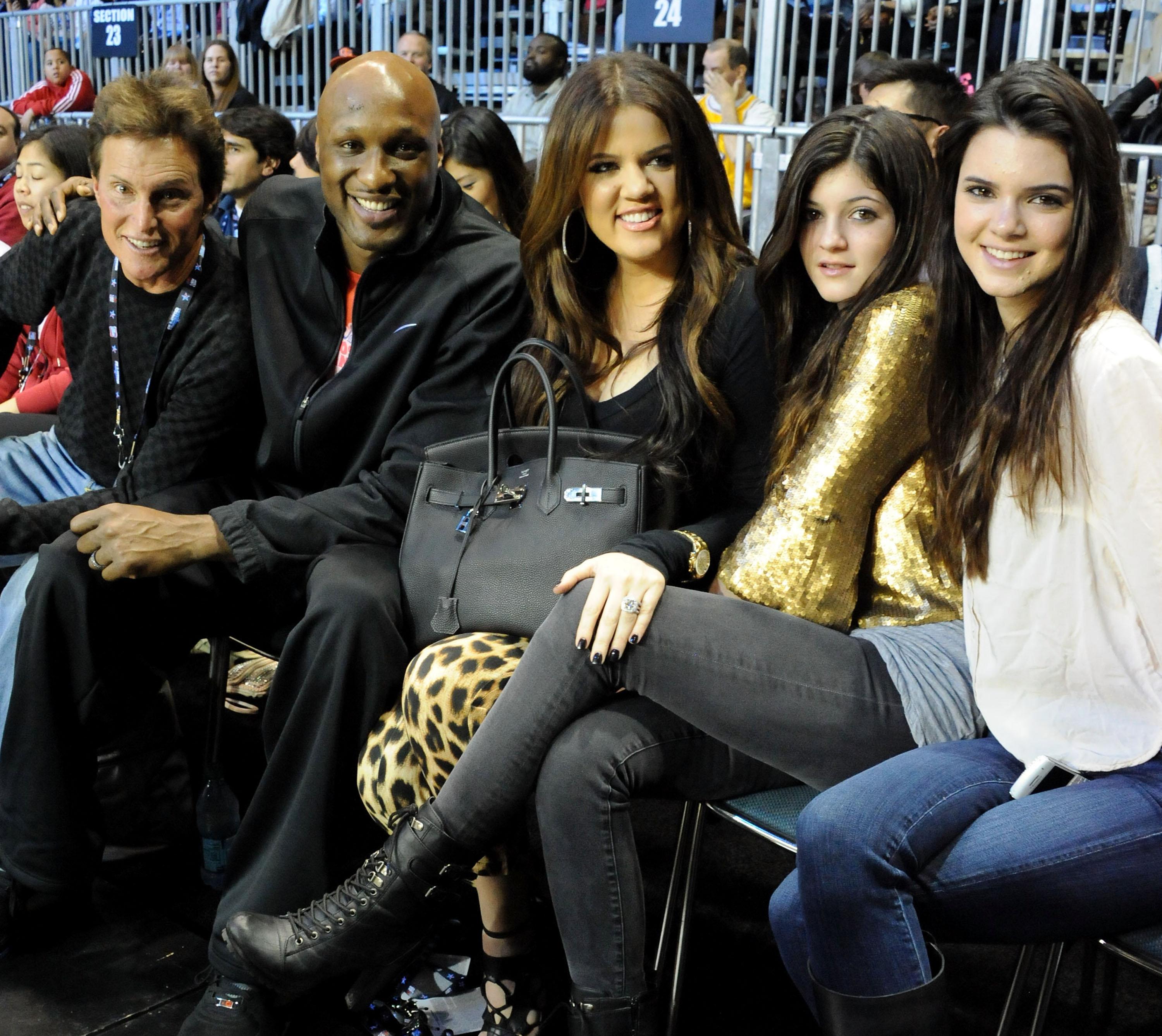 Khloe Kardashian and friends sitting courtside at an NBA game