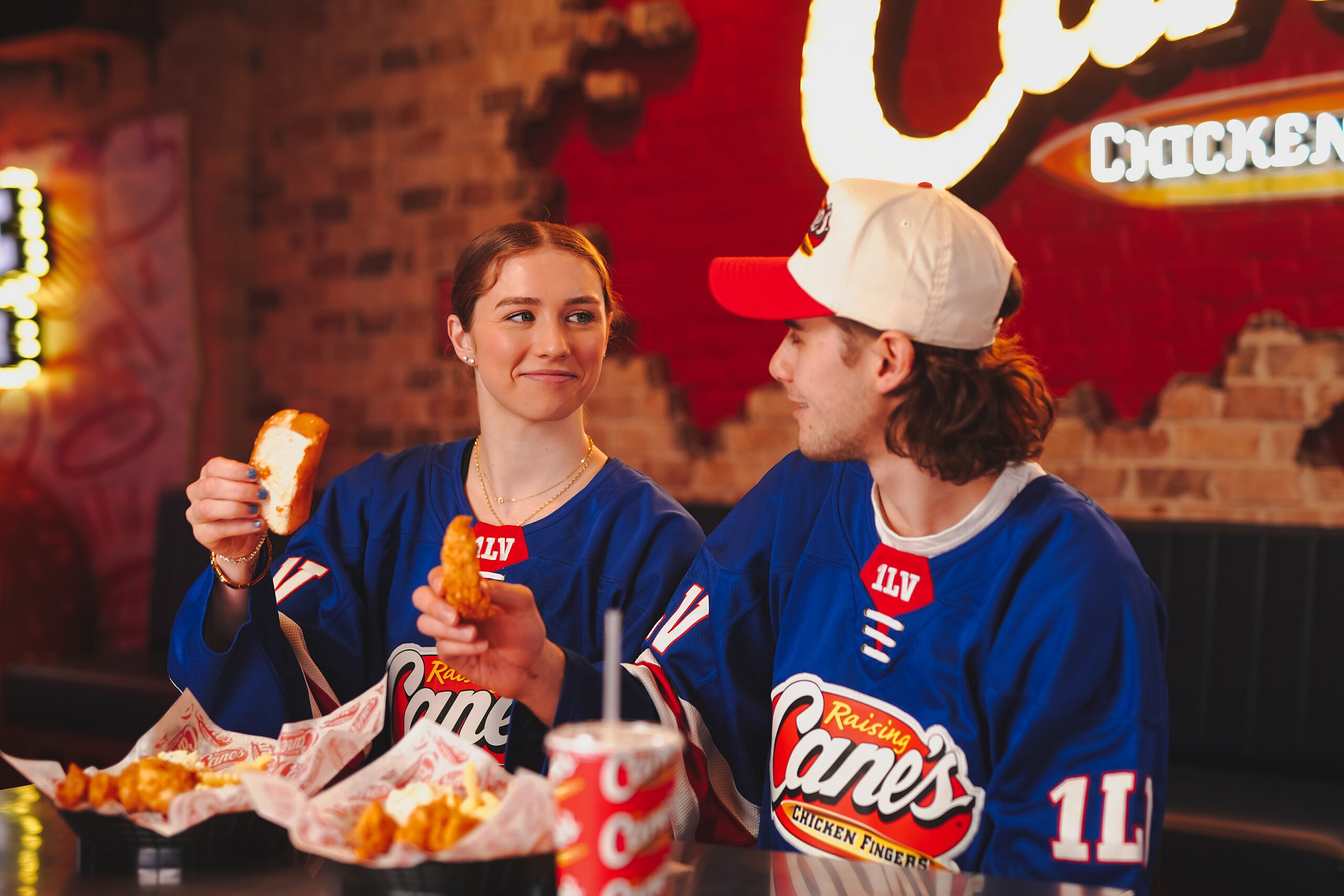 Caroline Harvey and Jack Hughes at Raising Cane's